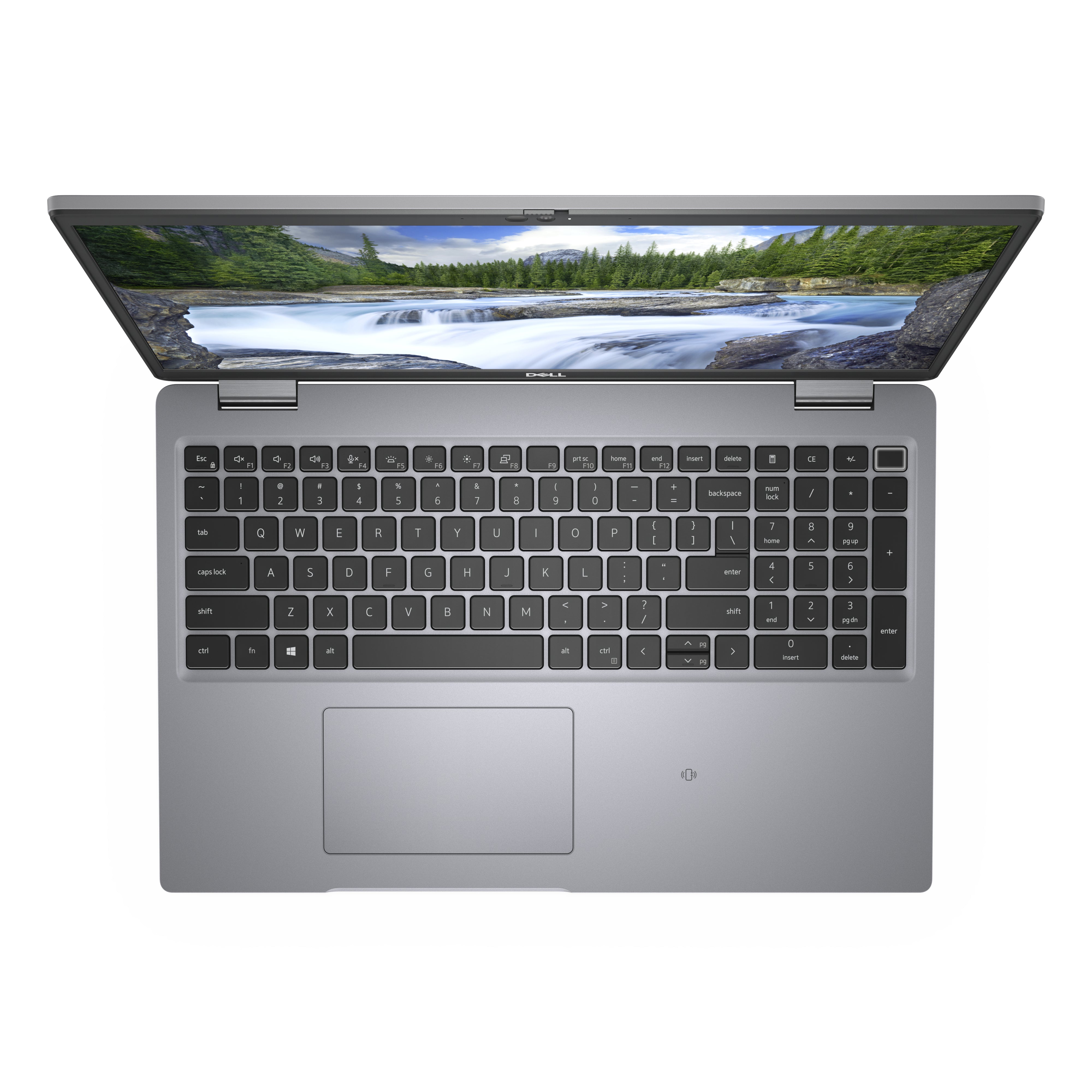 Refurbished Dell laptop open, silver keyboard, landscape on screen, top view